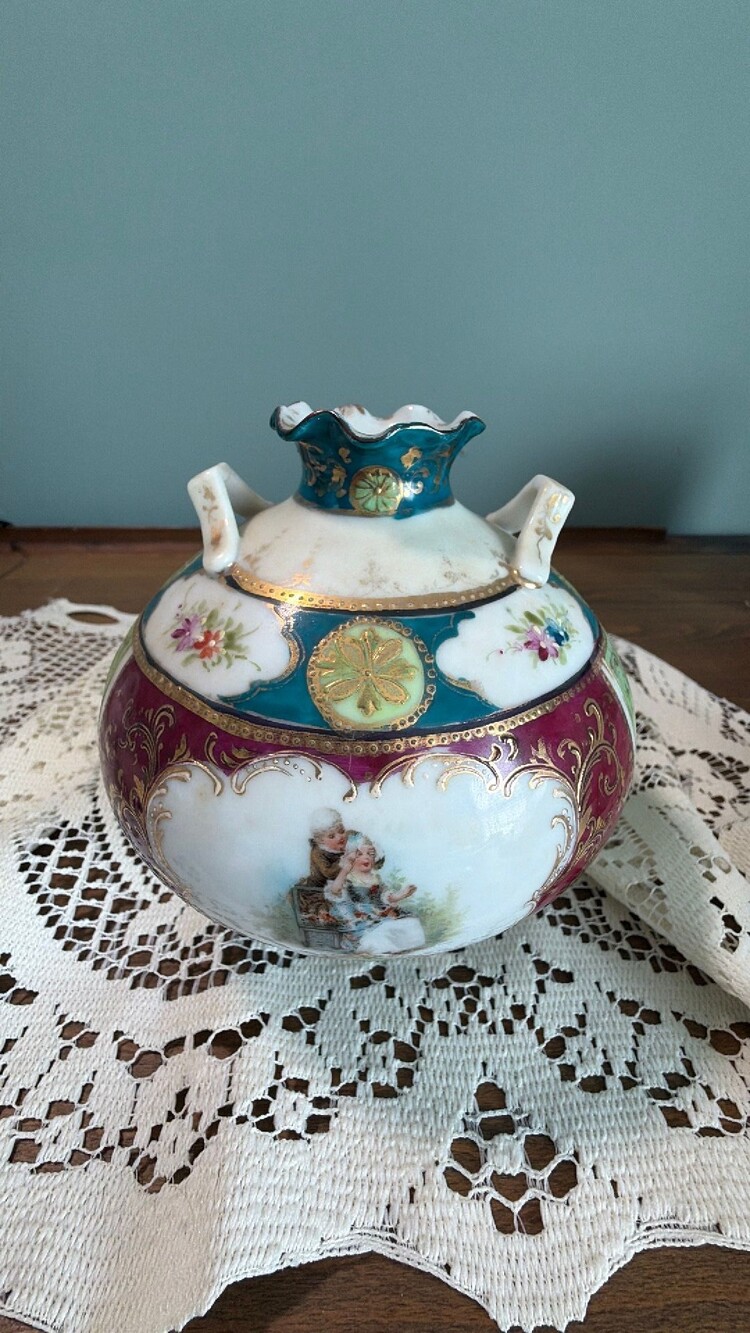 antique hand-painted porcelain rose bowl with gilt and romantic figures.